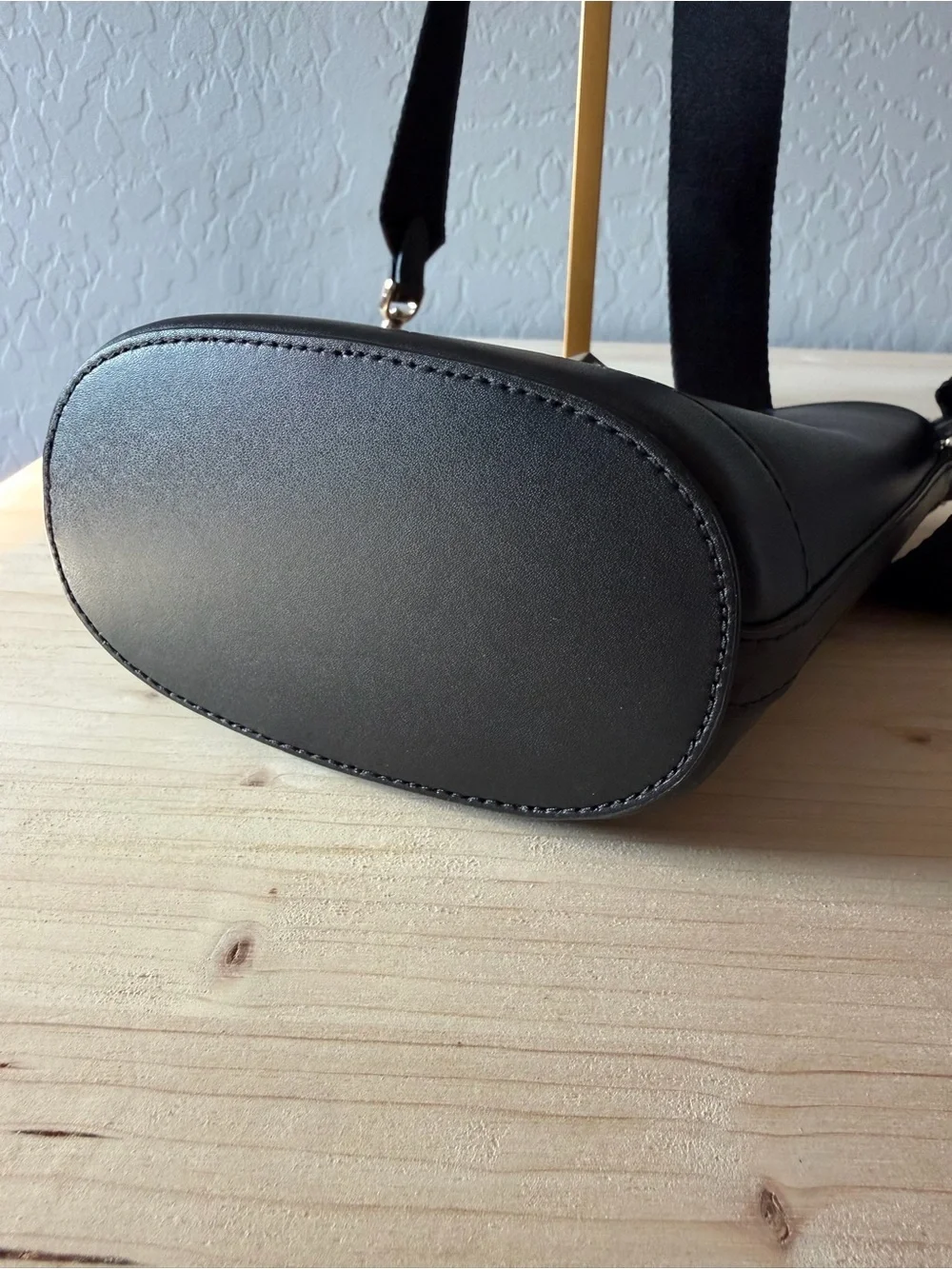 kate spade Black Leather Bucket Crossbody with Gold Medallion
